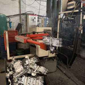 Robotic arm casting machine for power fittings manufacturing